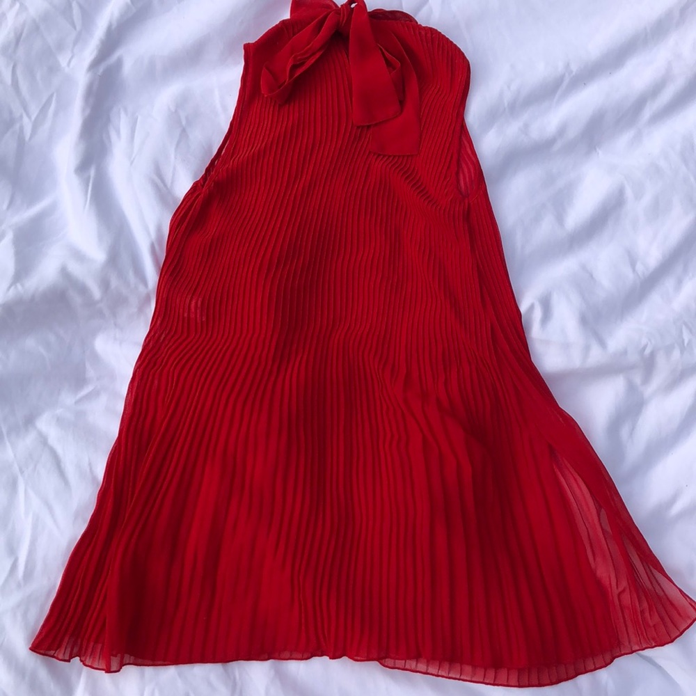 A trendy sheer red accordion shirt.